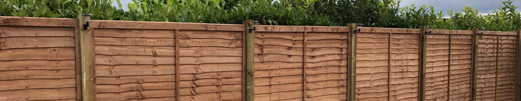 As you local fencing company, BN Fencing installed this larch lap fence